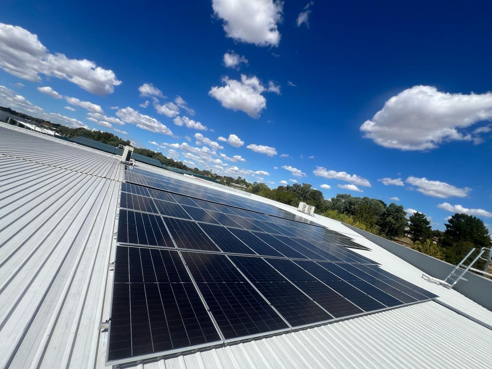 Accredited installer commissioning a solar and battery system at a Sydney property